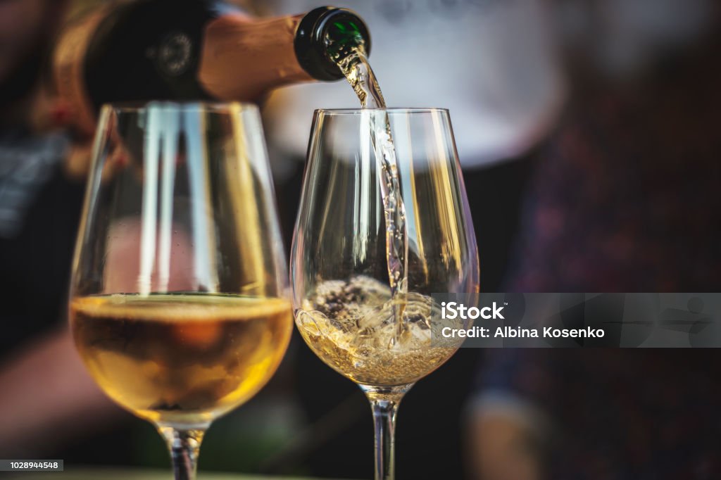 pouring rose champaign into a glass 2 glasses of rose champagne Champagne Stock Photo