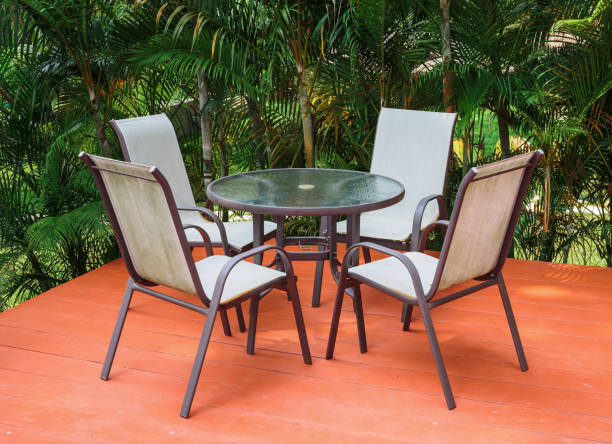 istock Table and chairs on the veranda in a tropical garden 1028944806