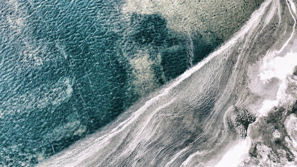 istock Icy water by the shore 1028944818