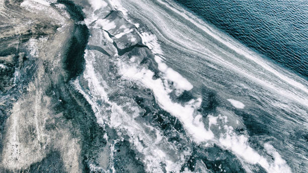 istock Icy water by the shore 1028944836