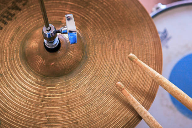 istock Pair of drumsticks lying on cymbal. 1028945108
