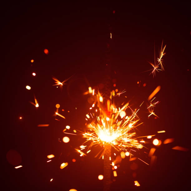 istock Christmas sparkler in haze with red light 1028956616