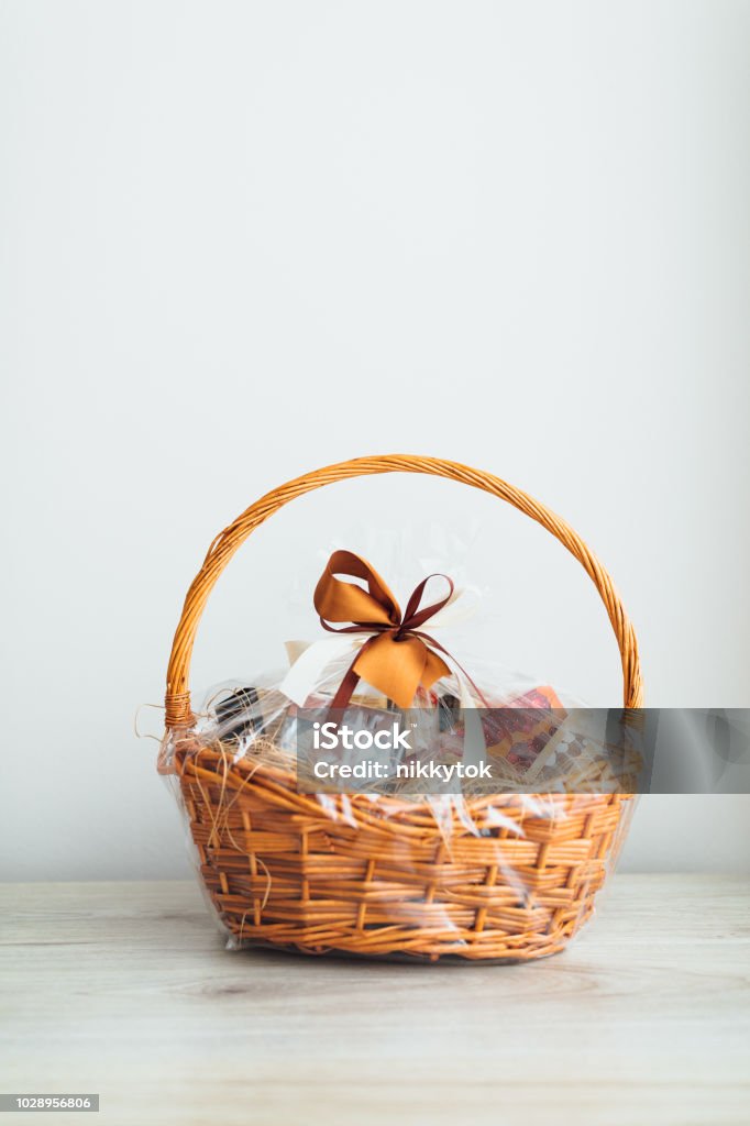 gift basket on gray background gift basket on gray background, close-up view Gift Basket Stock Photo