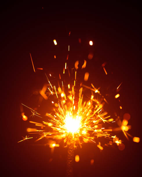 istock Christmas sparkler in haze with red light 1028957180