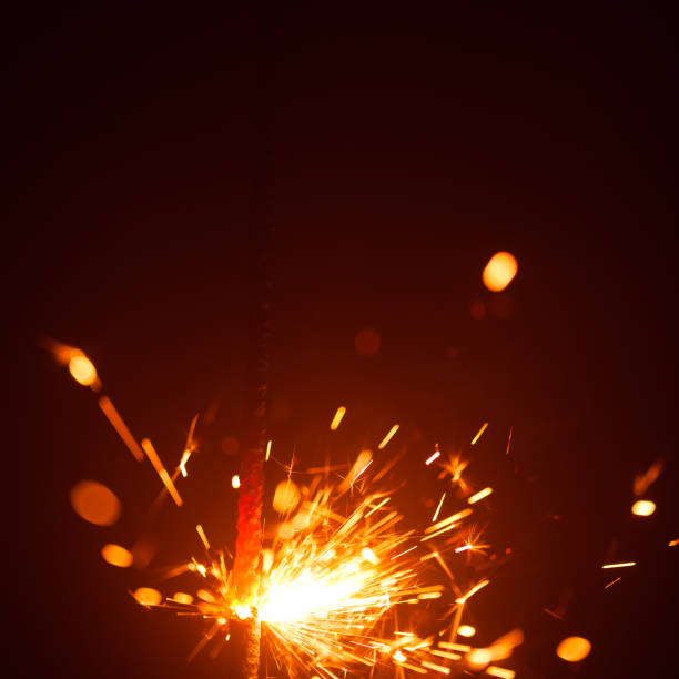 istock Christmas sparkler in haze with red light 1028957684