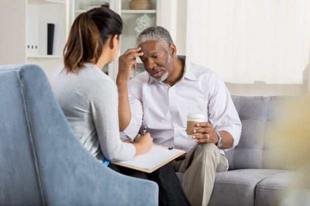 istock Anxious senior man talks with counselor 1028961952