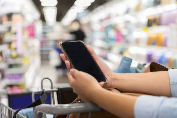 istock Woman uses grocery store mobile app 1028962082