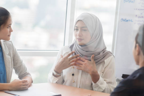 istock Serious female executive leads meeting 1028962338