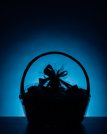 gift basket silhouette on blue background, close-up view