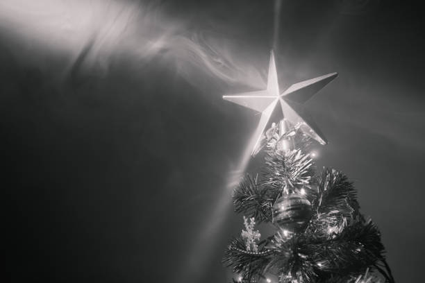 istock Christmas tree with festive star in smoke 1028966306