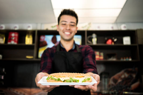 istock Man offers food 1028993564