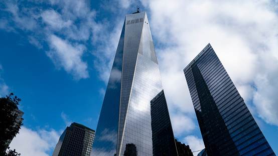 Aerial view of One World Trade Center in front of skyscraper buildings, New York City, New York State, USA.
