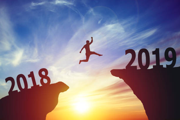 istock Silhouette of business man jumping from 2017 to 2018 1029000430