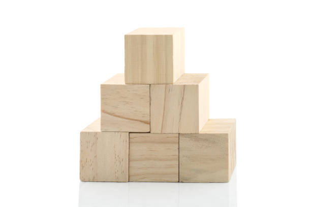 istock Wooden Building Blocks isolated against white background 1029000540
