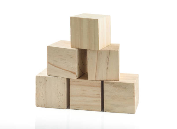 istock Wooden Building Blocks isolated against white background 1029000560