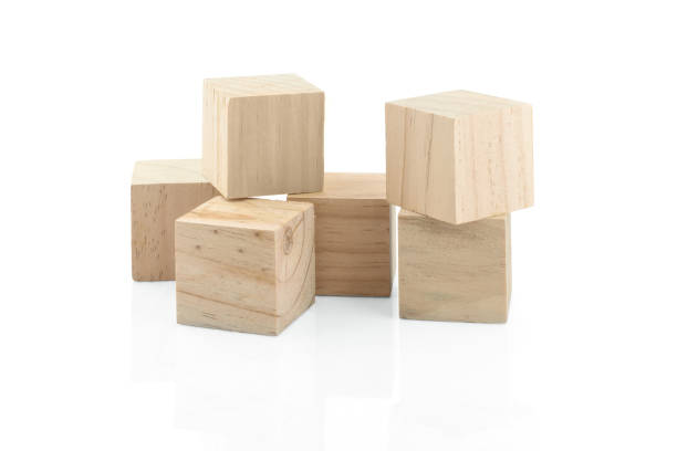 istock Wooden Building Blocks isolated against white background 1029000566