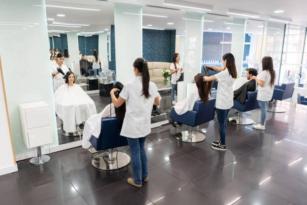 istock Group of hair stylist working each with a customer 1029003056