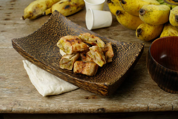 istock Thai Dessert, Grilled Banana with Coconut Sauce 1029005936