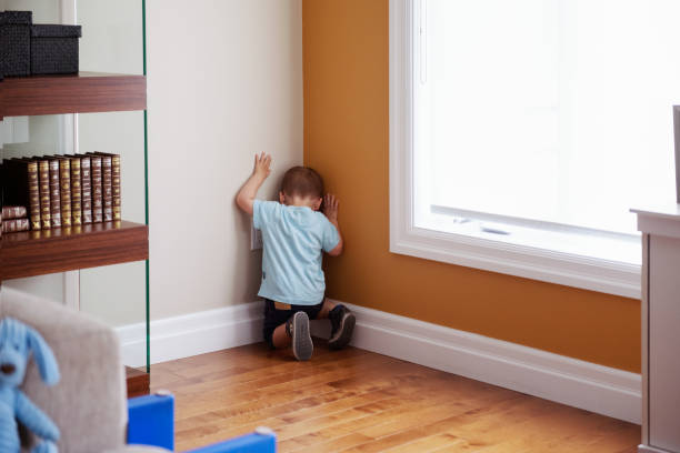 istock Two years old boy in punishment in a corner 1029005974