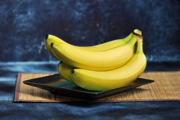 istock bunch of ripe bananas on a plate 1029008508