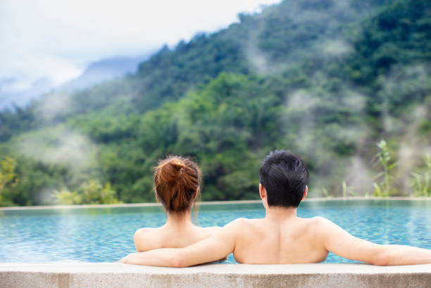 istock Young couple relaxing in hot springs 1029044366