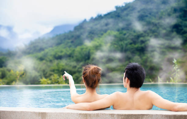 istock Young couple relaxing in hot springs 1029044384