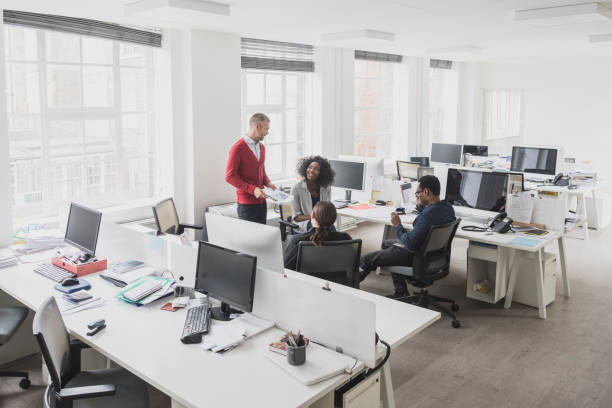 istock Business colleagues in creative modern office having morning meeting 1029044432