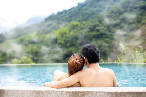 istock Young couple relaxing in hot springs 1029044482