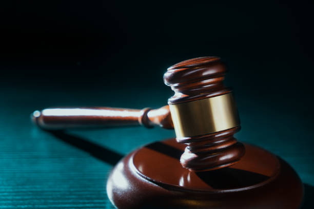 istock Judge hammer on a wooden background 1029076990