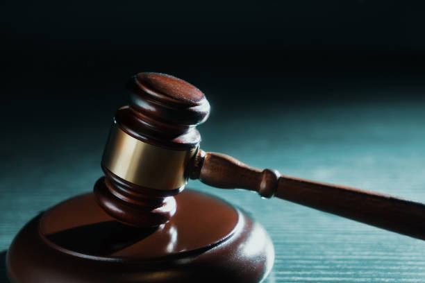 istock Judge hammer on a wooden background 1029077120