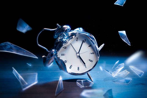 istock Alarm clock with broken glass on dark background 1029087306