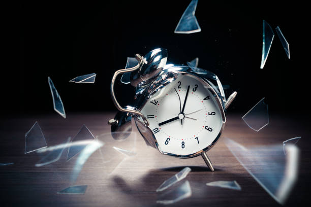 istock Alarm clock with broken glass on dark background 1029087662