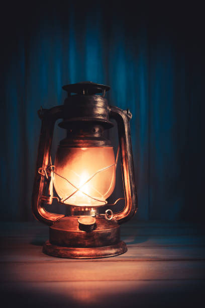 istock Kerosene lantern on wooden background 1029090960
