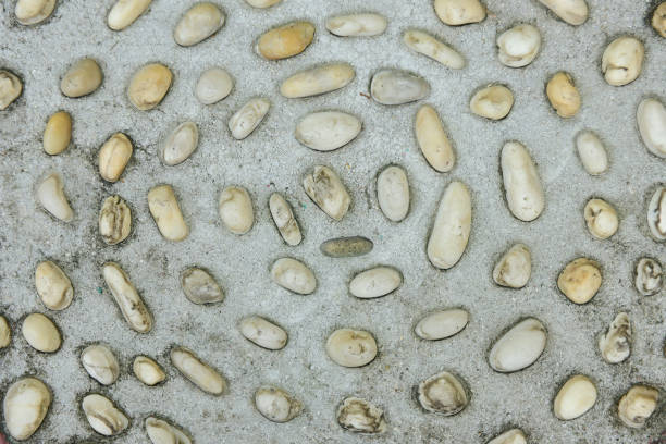 istock Colorful stones wall texture, white and black stones on pattern. 1029093210