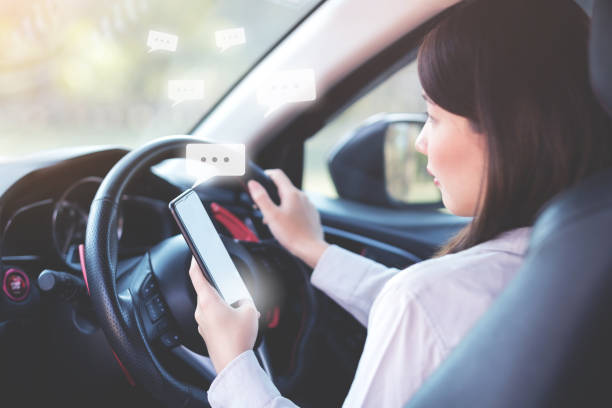 istock Woman texting message by smart phone while on a car 1029101514
