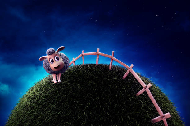 istock Cute sheep on grass next to a fence at night 1029102070