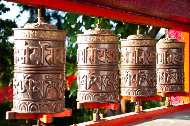 Tibetan Metal Mantra Wheel Tibetan Metal Mantra Wheel buddhist prayer wheel stock pictures, royalty-free photos & images