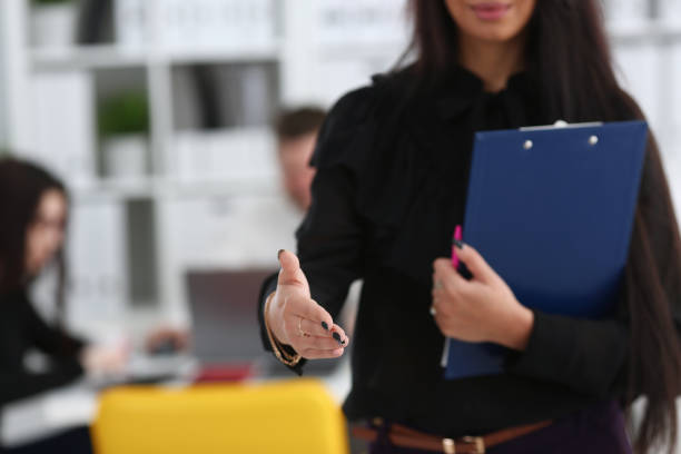 istock Woman hold document pad give arm as hello 1029109848