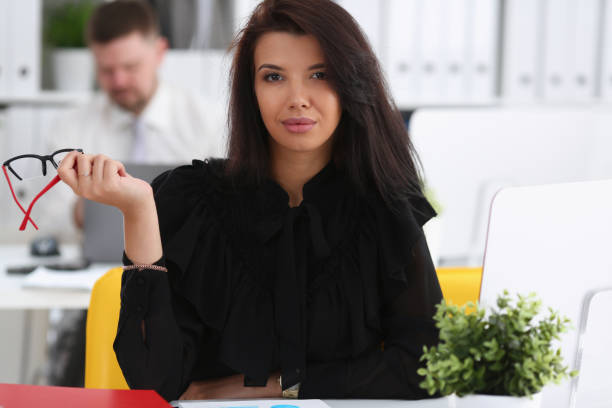 istock Beautiful smiling brunette woman sit at work table 1029109906