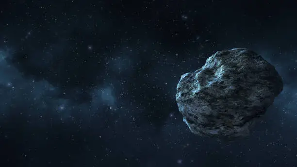 an asteroid or a meteorite flies in space, against the background of nebulae and stars