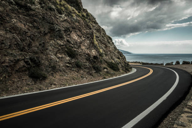 istock winding coastal road under overcast sky 1029117482