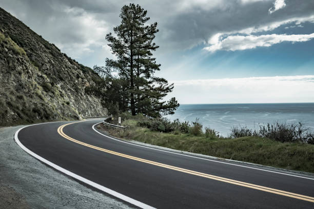 istock winding coastal road under overcast sky 1029117716