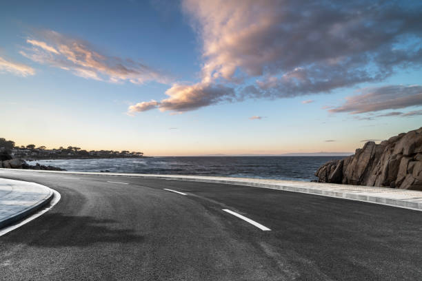 istock empty coastal highway against sea and sky 1029121878