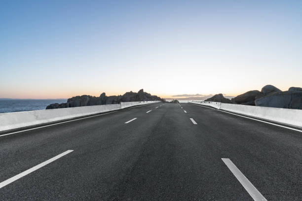 istock empty coastal highway against sea and sky 1029125146
