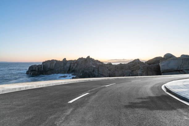 istock empty coastal highway against sea and sky 1029125272