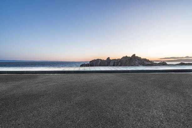 istock empty coastal highway against sea and sky 1029125316
