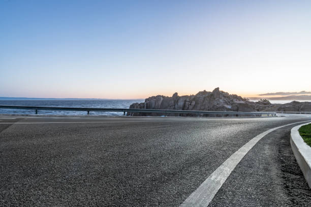 istock empty coastal highway against sea and sky 1029125350