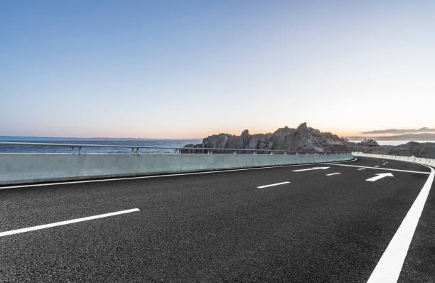istock empty coastal highway against sea and sky 1029125352