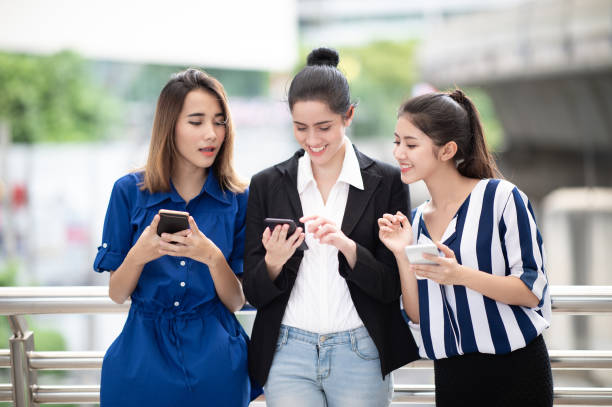 istock group Pretty woman texting on the phone 1029127544