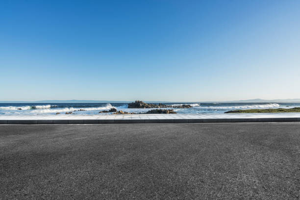 istock tarmac road at coast against sky 1029128036